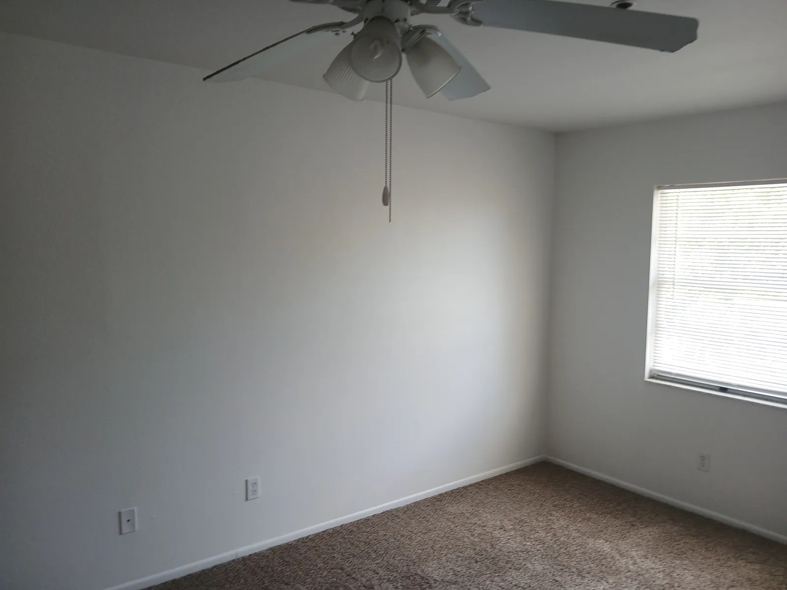 The same bedroom after the walls were repainted