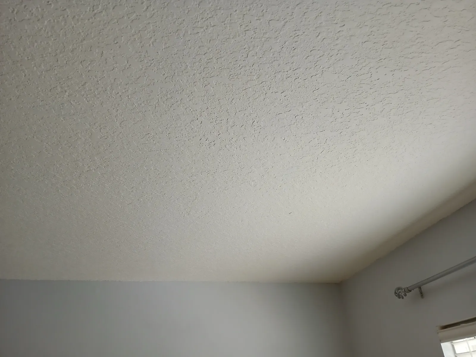 The same ceiling repainted, with no stain showing